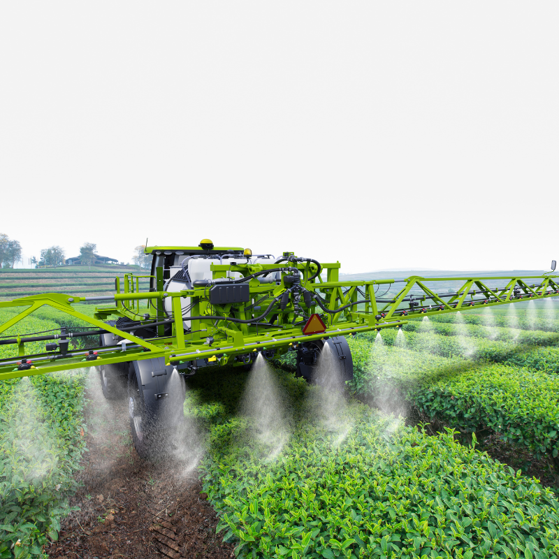 Crop srayer applying liquid fertilizer to crops in the field